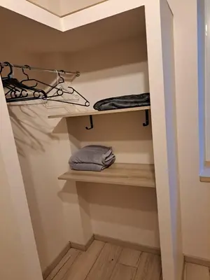 a walk in closet with shelves and towels at Gîte La Dolce Vita in Saint-Félix-Lauragais