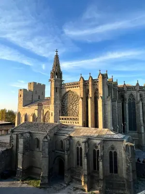 an old church with a tower in front of it at L’UNDERGROUND Studio Hyper-Centre in Carcassonne