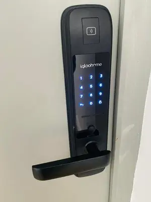 a black remote control is attached to a door at Le studio Hyper-centre in Carcassonne