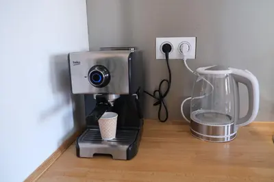 a coffee maker and a blender on a table at A l'ombre des remparts in Carcassonne