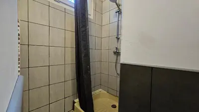 a bathroom with a shower with a toilet in it at La Pause Laurag-aise l'embleur Oc Keys 27 in Castelnaudary