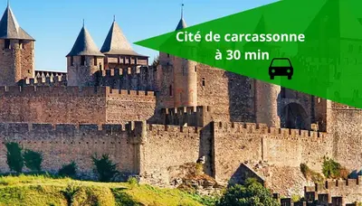 a large medieval castle with a green overlay at La Pause Laurag-aise l'embleur Oc Keys 27 in Castelnaudary