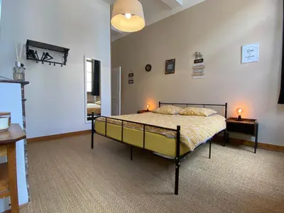a bedroom with a bed with two lamps on it at Rooftop Face à la Cité 'RFC' in Carcassonne