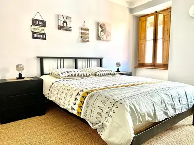 a bedroom with a bed and a window at Rooftop Face à la Cité 'RFC' in Carcassonne