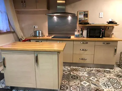 a kitchen with a counter top and a microwave at Carcahouse in Carcassonne