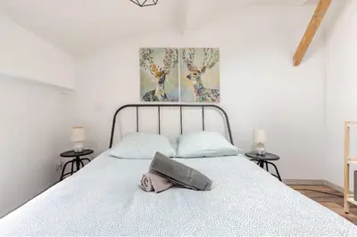 a bedroom with a bed with a pillow on it at Appartement 