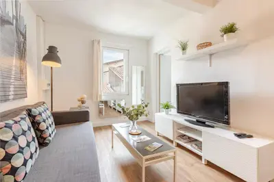 a living room with a large flat screen tv at Appartement 