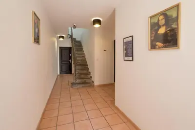 a hallway with a staircase in a house at Studio Baignoire centre ville in Narbonne