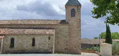an old stone building with a tower on top at La maison de mon enfance ! Au cœur du Minervois ! in Félines-Minervois