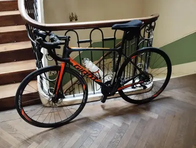 a bike is parked next to a staircase at Maison Alba La Source in Mazamet