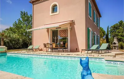 a person is jumping into a swimming pool at Beautiful Home In Carcassonne in Carcassonne