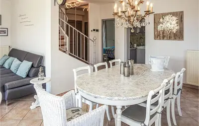 a dining room with a table and chairs at Beautiful Home In Carcassonne in Carcassonne