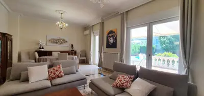 a living room with couches and a dining room at La casa de Margarita y Sisco, Villa avec piscine in Carcassonne