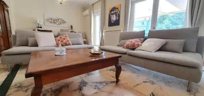 a living room with two couches and a coffee table at La casa de Margarita y Sisco, Villa avec piscine in Carcassonne