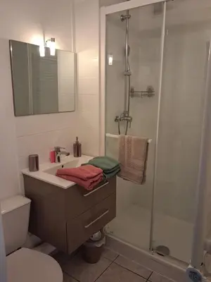 a small kitchen with a sink and a microwave at Studio Grazel classé 1 étoile au calme Rez de chaussée avec piscine et jardin in Gruissan