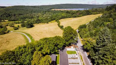 an aerial view of a road next to a field at Au bois de Mars in Les Martys