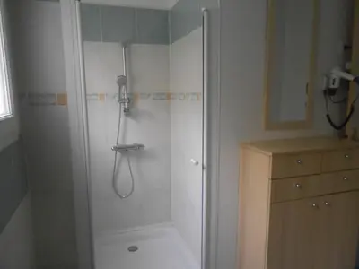 a shower stall in a bathroom with a shower at Appartement Aloa in Carcassonne