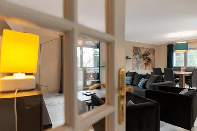 a living room with a couch and a table at Appartement Aloa in Carcassonne