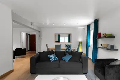 a living room with a couch and a table at Appartement Aloa in Carcassonne