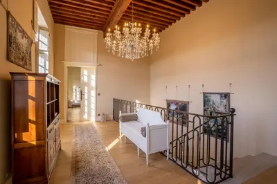 a large dining room with a table and chairs at Les Cazettes in Damiatte