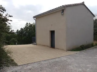 a large building with a door on a driveway at Gites Arnoult in Damiatte
