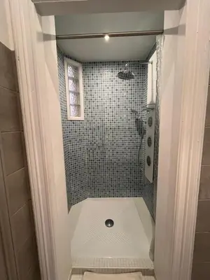 a bathroom with a shower with a toilet in it at Les clématites in Narbonne