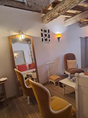 a living room with blue furniture and a piano at La maison SPA, PISCINE et CLIMATISATION in Sainte-Vallière