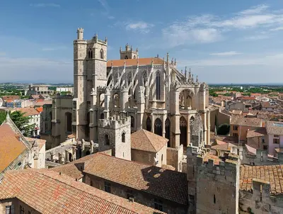 a view of a cathedral with roofs of buildings at Domaine Les Cascades in Ribaute