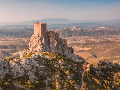 a castle on the top of a mountain at Domaine Les Cascades in Ribaute