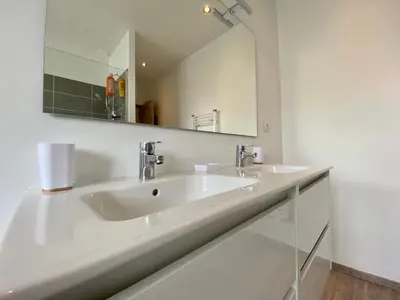 a bathroom with a shower and a sink at Maison Tommy in Carcassonne