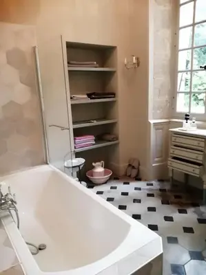 a bathroom with a white tub and a sink at Maison d'Hôtes de La Rivière in Pexiora