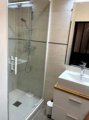 a bathroom with a shower and a sink at Pause Cathare in Chalabre