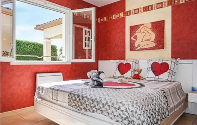 a bedroom with a bed with two teddy bears on it at Stunning Home In Puisserguier in Puisserguier