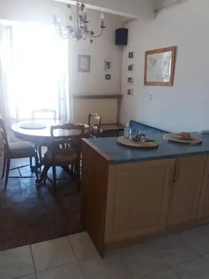 a kitchen with a table and a table and a dining room at Chateau View Chambres d'hôtes in Quillan