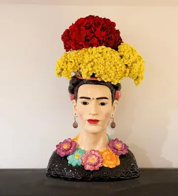 a statue of a woman with flowers on her head at Origines in Tautavel