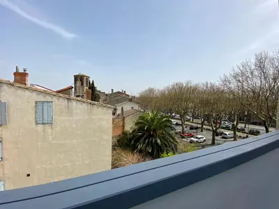 a view of a street from a balcony at Studios Sauzède - Carcassonne centre-ville in Carcassonne