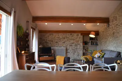 a living room with a table and chairs at Gîte - Holiday Home Vent Tramontane in Limoux