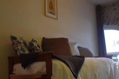 a bedroom with a bed with blankets and pillows at Gîte - Holiday Home Vent Tramontane in Limoux