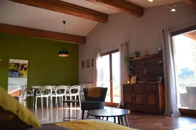 a living room with a table and chairs at Gîte - Holiday Home Vent Tramontane in Limoux