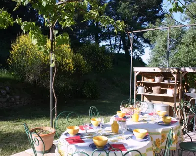 a table with food on it in a garden at Domaine de 