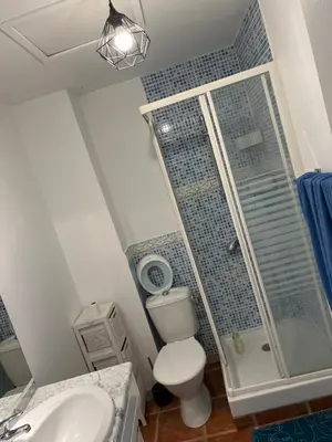 a bathroom with a shower and a toilet and a sink at Loft Toit Terrasse - Confort & Nature à Sigean in Sigean