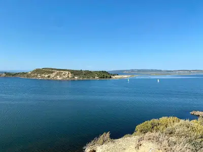 an island in the middle of a large body of water at Loft Toit Terrasse - Confort & Nature à Sigean in Sigean
