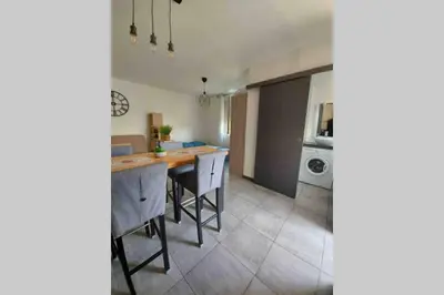 a kitchen with a counter and a table in it at Location studio entre garrigue et mer in Vinassan