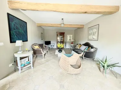 a living room with couches and chairs at Le Domaine de La Tuilerie - Gite de charme en bord de riviere avec piscine in Serviès-en-Val