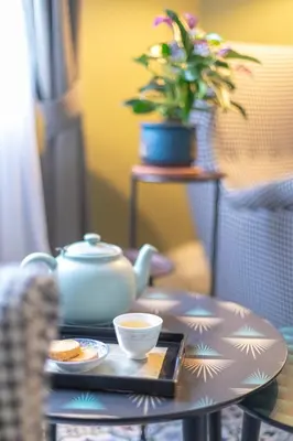 a teapot and a cup of coffee on a table at Maison d'hôtes ÔVillage in Ouveillan