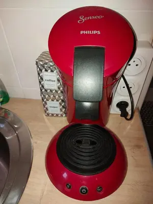 a red blender sitting on a counter next to a stove at studio au calme wifi 600m centre ville parking privé in Castres