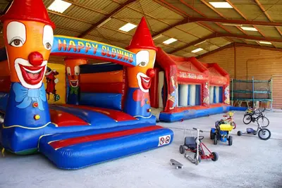 a inflatable playground with a happy birthday play set at Domaine Las Brugues in Saint-Papoul