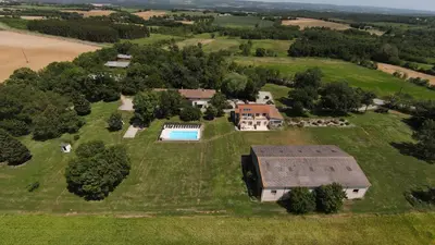 an aerial view of a house with a swimming pool at Domaine Las Brugues in Saint-Papoul