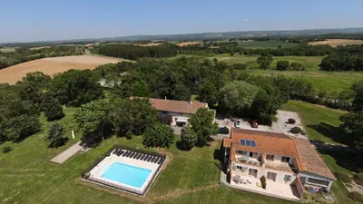 an aerial view of a house with a swimming pool at Domaine Las Brugues in Saint-Papoul