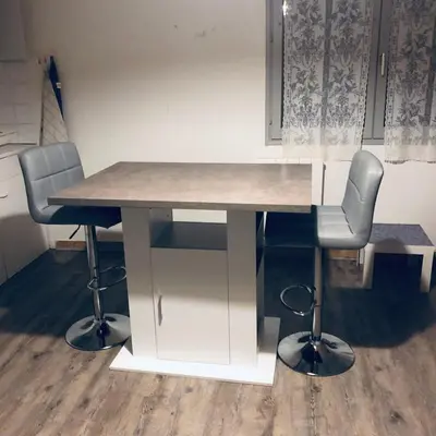 a white desk with two chairs and a table at Studio meublé Viane in Viane